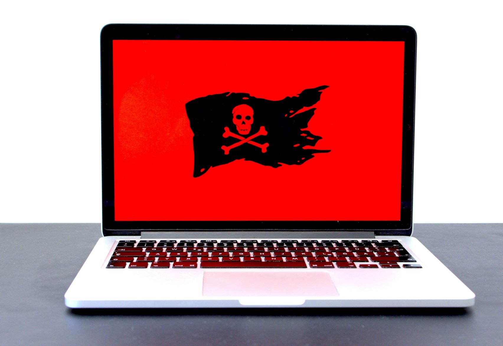 IT team responding to a ransomware incident on a laptop screen