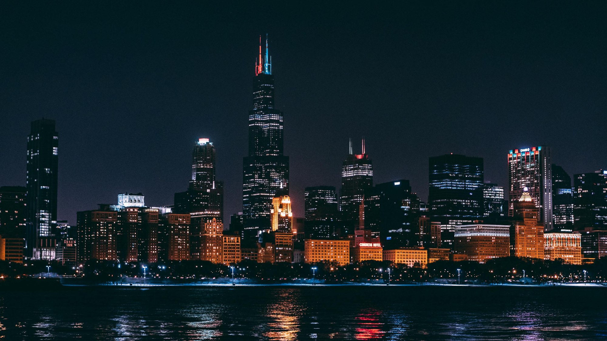 Stunning Night View Of Chicago Skyline Highlighting Illuminated Skyscrapers Across The Water. 1797195 Scaled